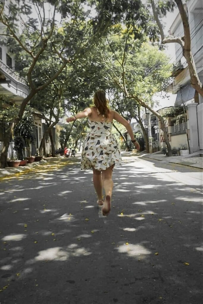 Running girl, Vietnam, Bird dress